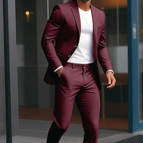 Person wearing a burgundy suit with a white shirt in an urban setting