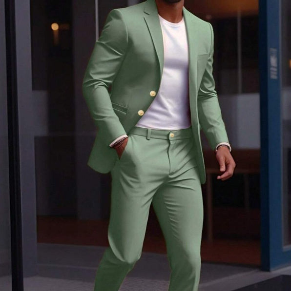 Person wearing a green suit with a white shirt in an indoor setting