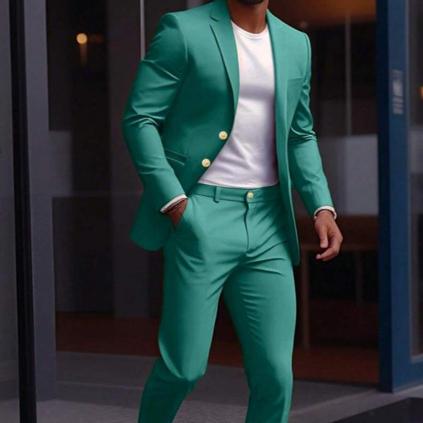 Person wearing a green suit with a white shirt in an indoor setting