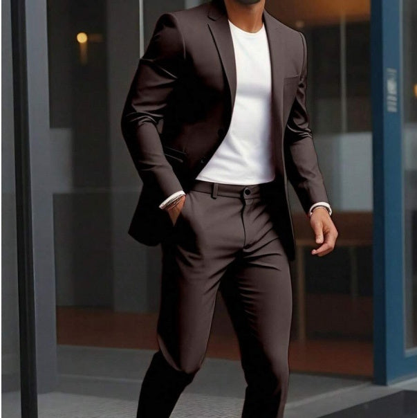 Man wearing a brown suit with a white shirt in an indoor setting